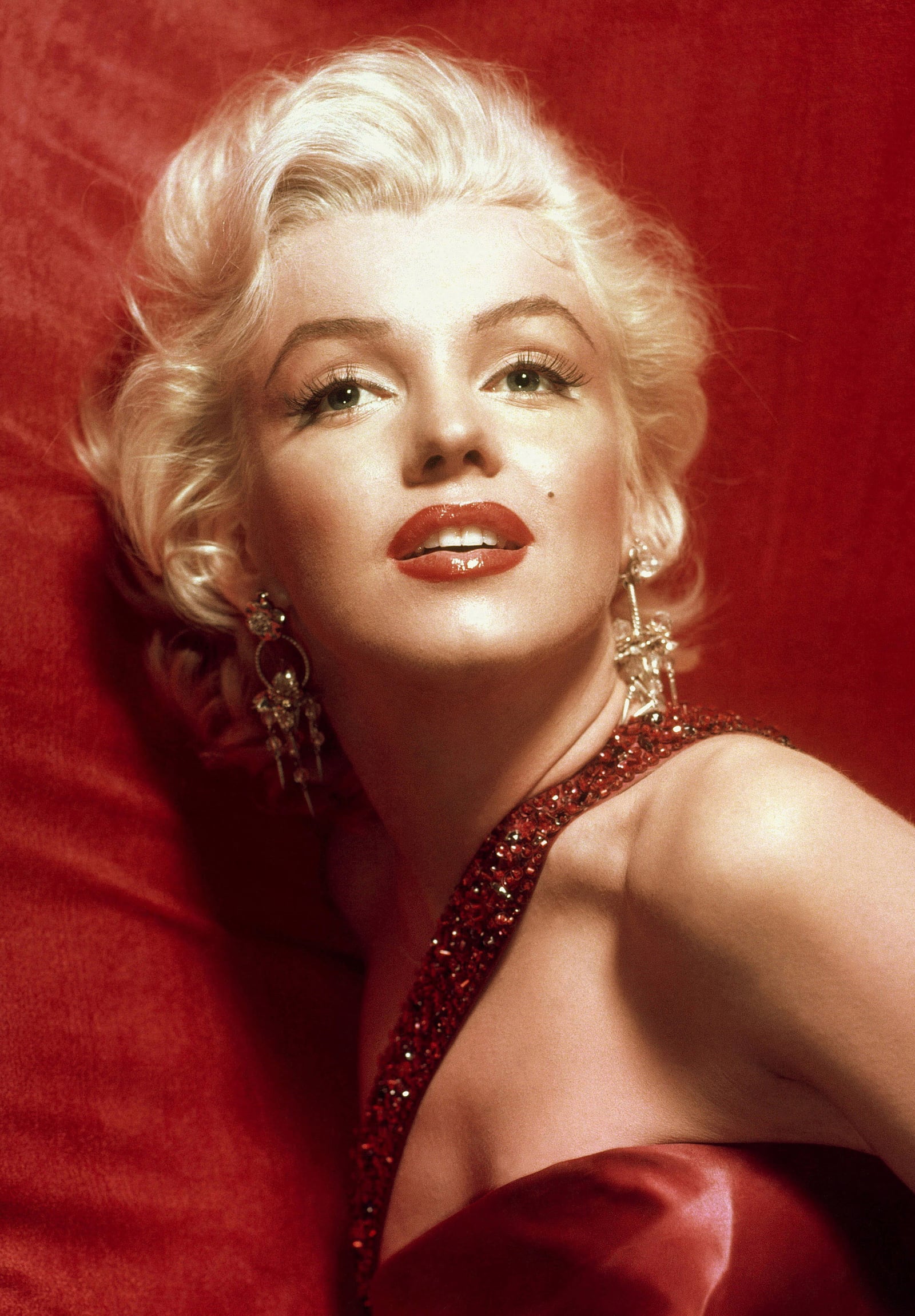 A glamorous Marilyn Monroe in a red dress, taken for publicity purposes for 1953 film How to Marry a Millionaire.