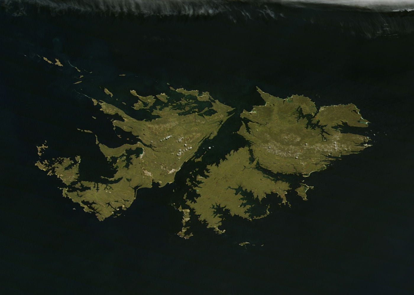 The green lands Falkland Islands sparkle in the southern Atlantic Ocean about 250 nautical miles (460 miles) off the coast of southern Argentina. Also known as Islas Malvinas, the archipelago consists