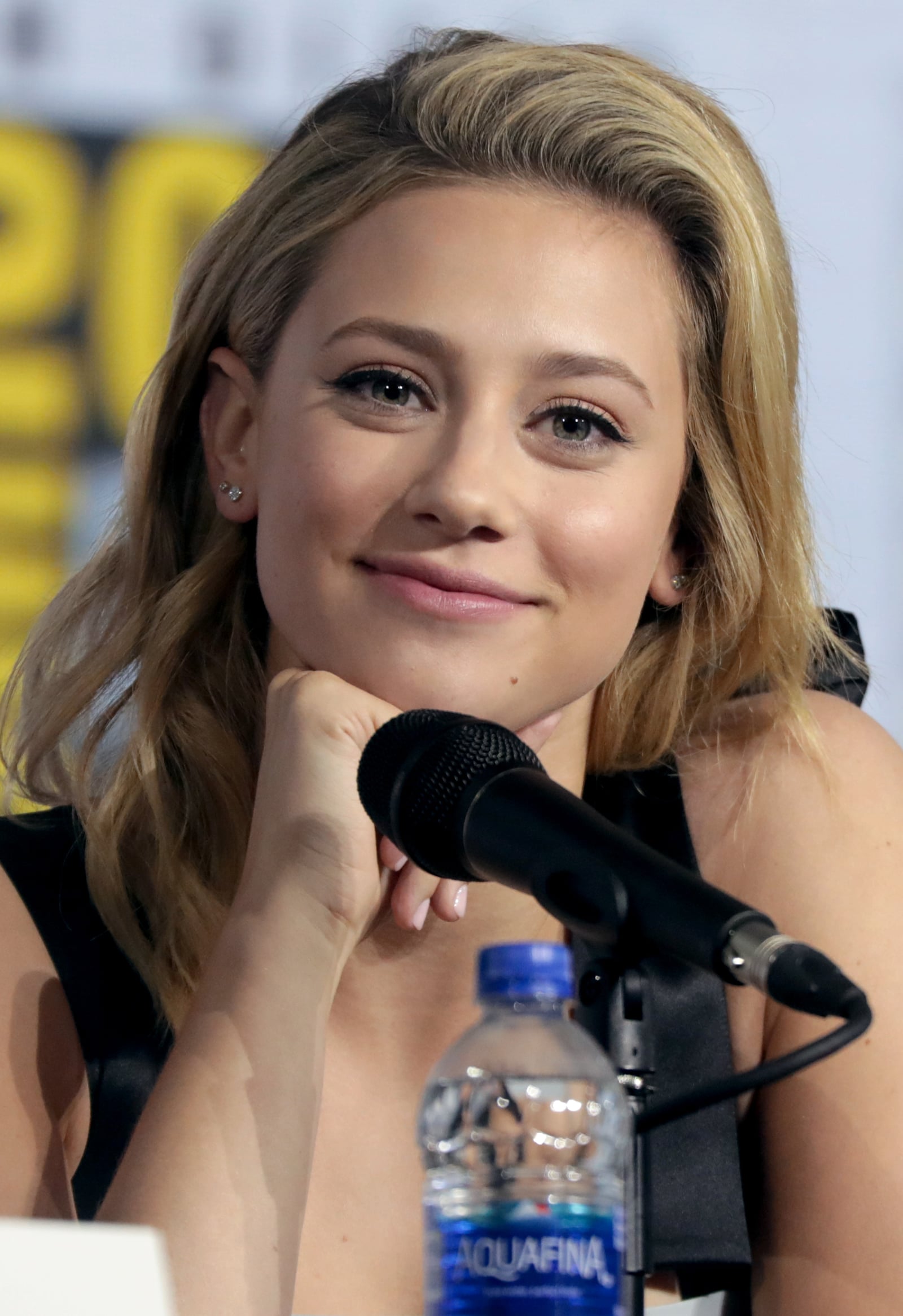Lili Reinhart and Cole Sprouse speaking at the 2019 San Diego Comic Con International, for "Riverdale", at the San Diego Convention Center in San Diego, California. Please attribute to Gage Skidmore i