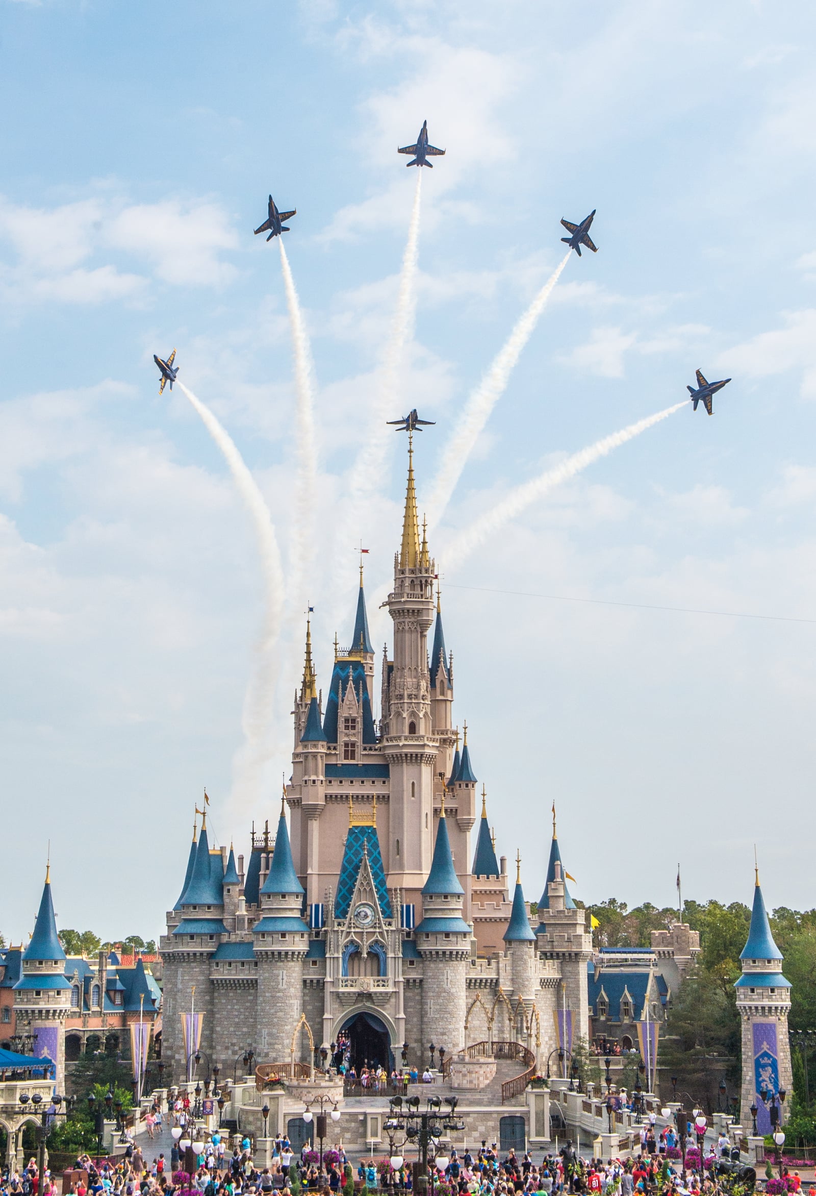 170406-N-IR734-094 ORLANDO, Fla. (April 6, 2017) U.S. Navy Flight Demonstration Squadron, The Blue Angels perform the Delta Breakout over Cinderella's Castle at Walt Disney World's Magic Kingdom en ro