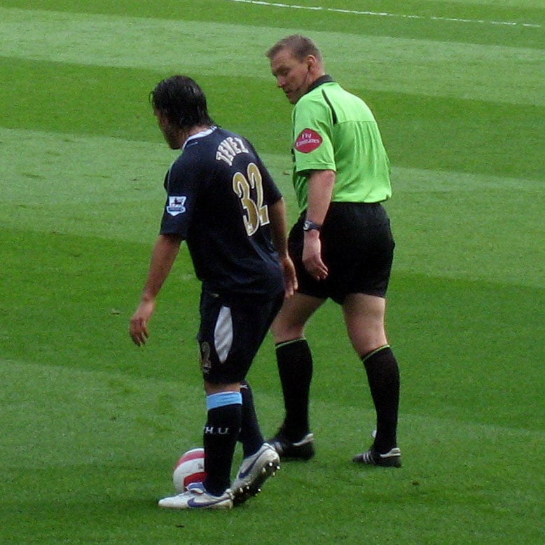 Carlos Tévez (left) in action for West Ham in a match against Arsenal.