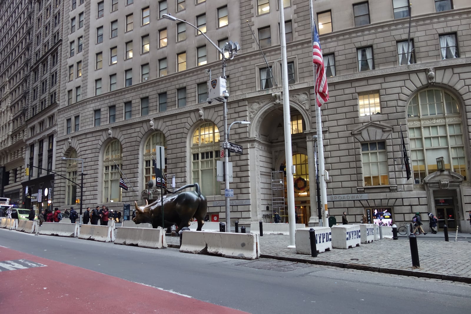 Looking west towards 26 Broadway and the Charging Bull at Broadway and Morris Street in Bowling Green, Financial District, Manhattan. This is one of the few times where tourists haven't completely sur